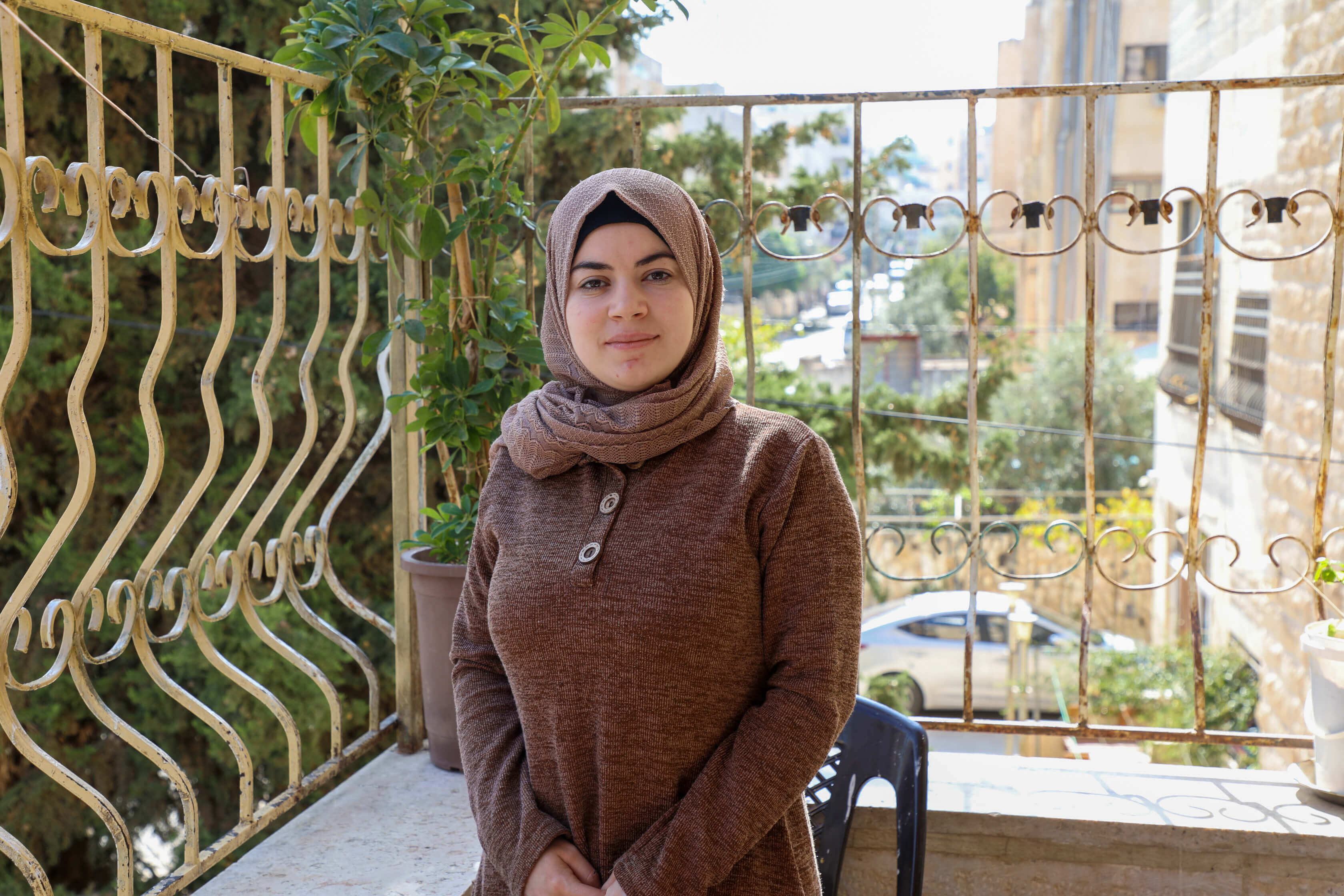 Syrian refugee, Tahani, 26, is photographed at home in Irbid, Jordan.