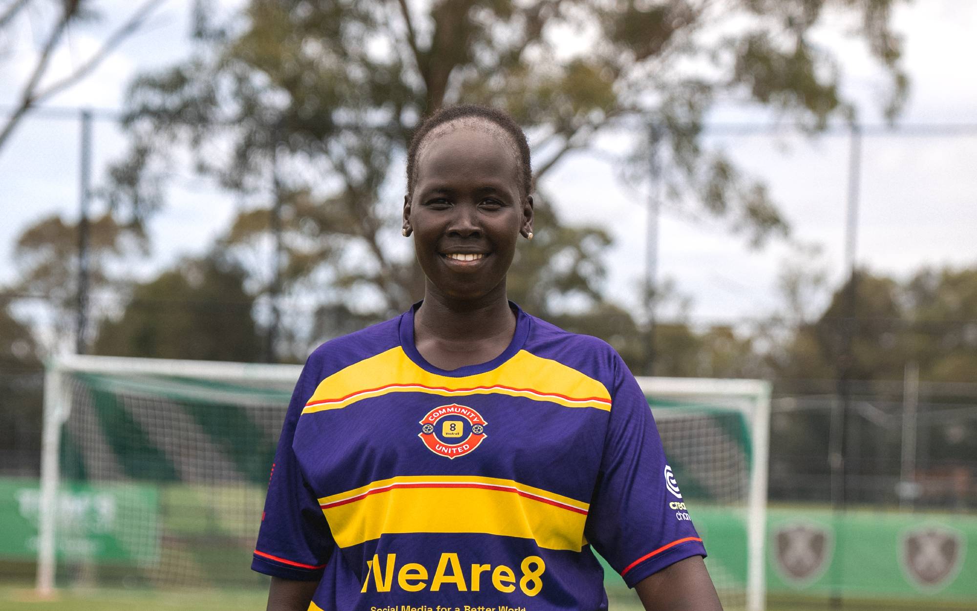 Anyier Yuol smiles on the soccer pitch