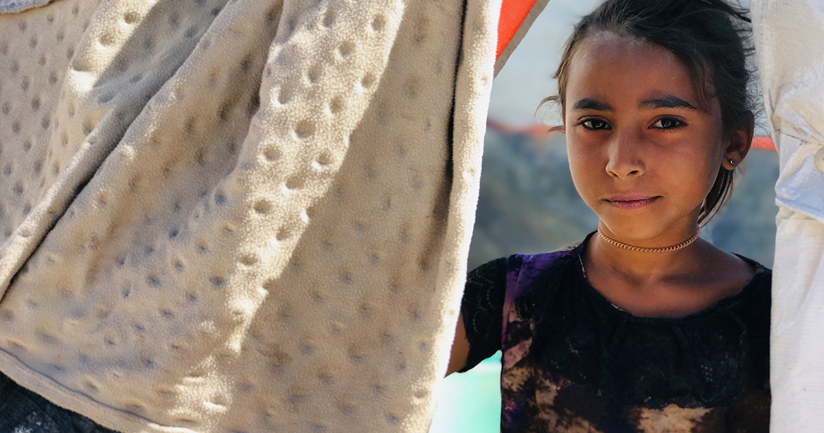 A young girl faces camera © UNHCR/Arwa Al Sabri