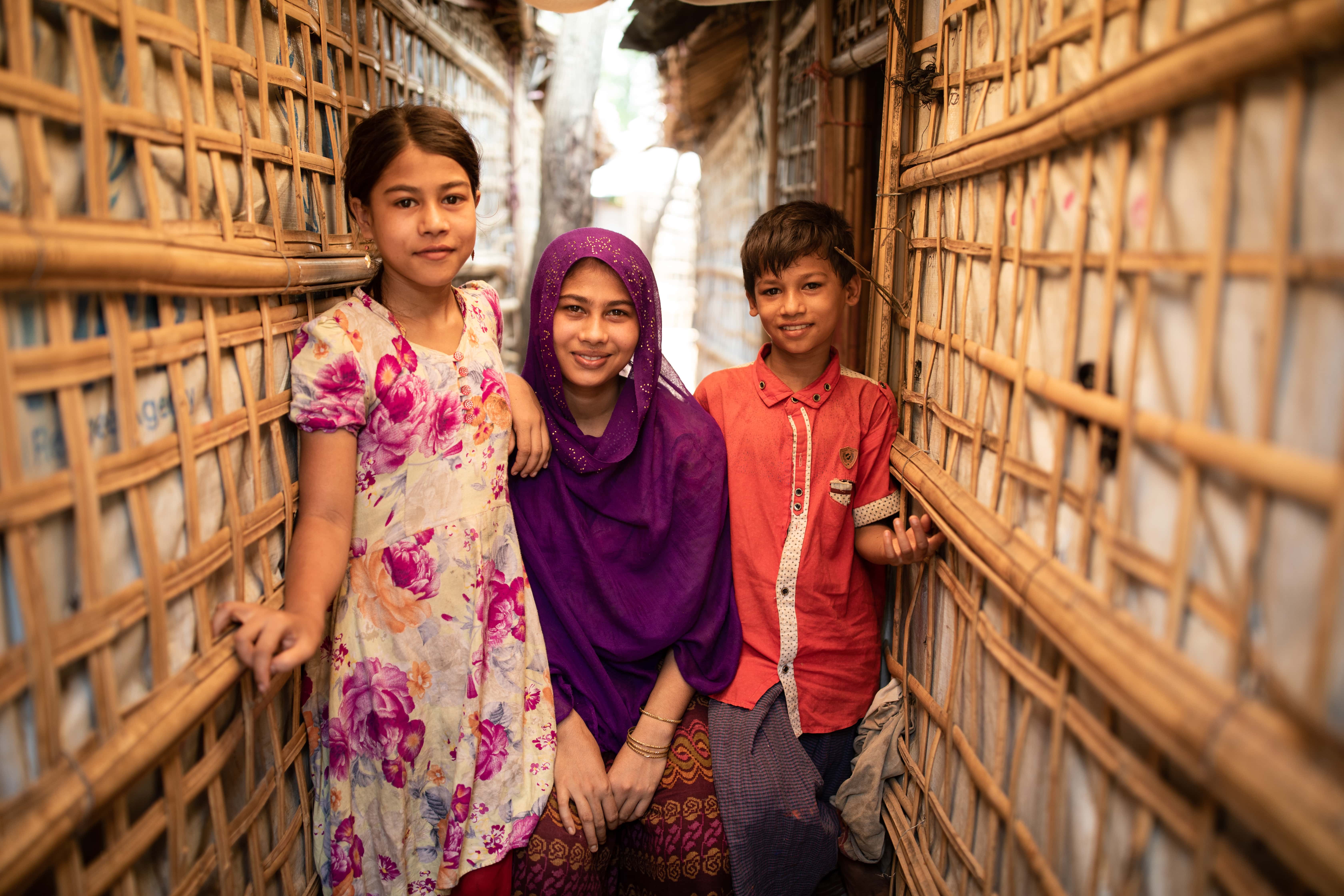 Rohingya refugee Ayesha cares for her younger brother and sister in a Cox’s Bazar refugee settlement.