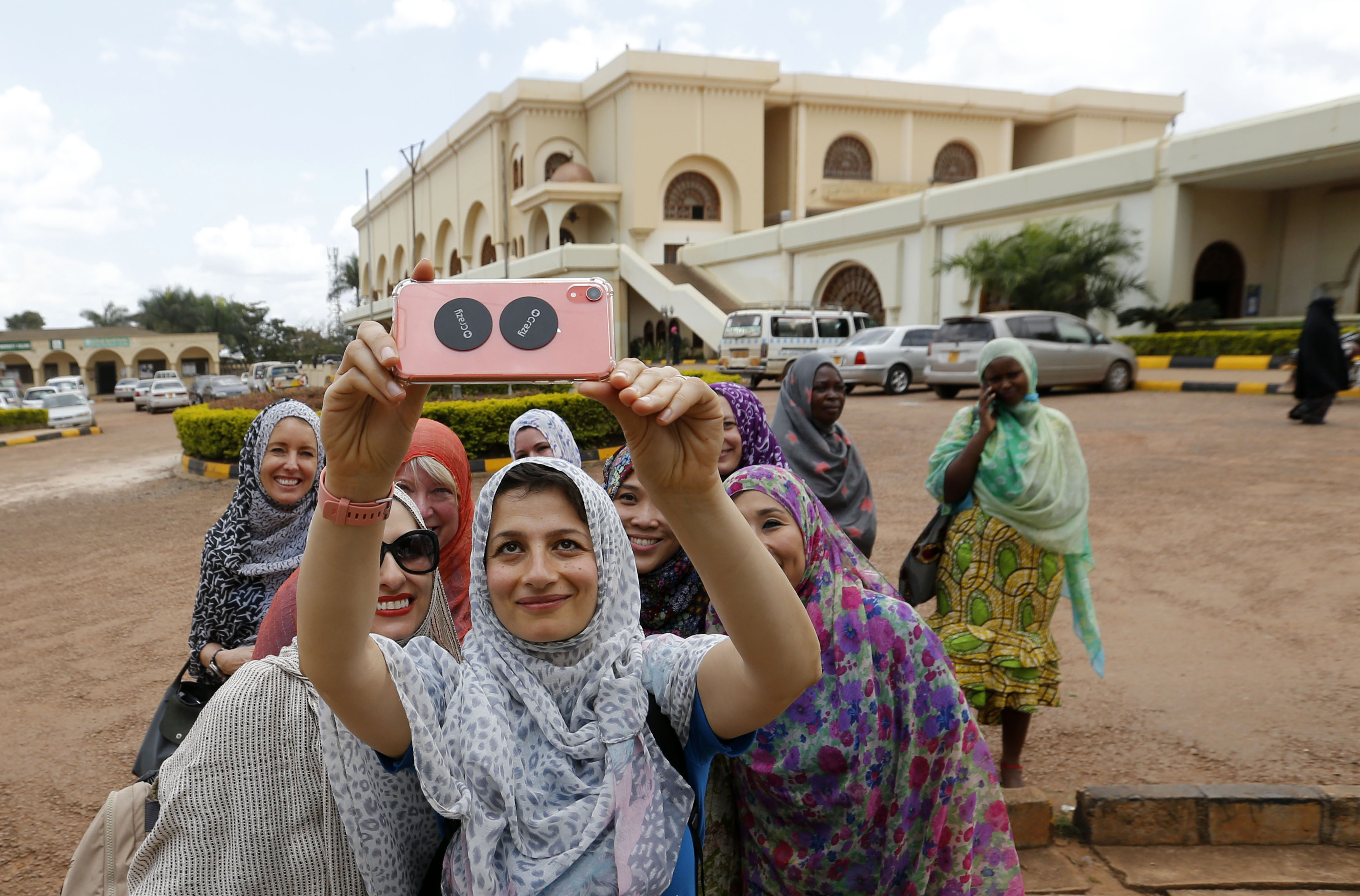 Zoe Ghani takes a selfie with women in Uganda