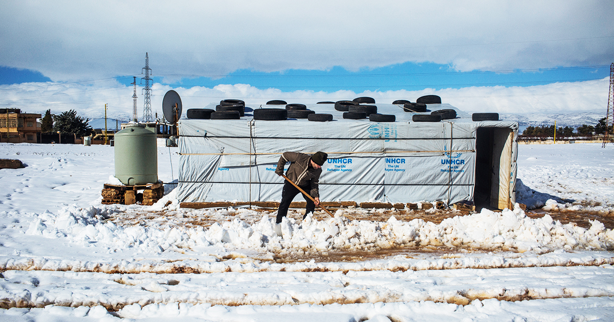 Ahmed, a Syrian refugee from Raqqa, removes snow with a shovel outside his home in the informal settlement camp of Doures, Lebanon. @UNHCR/ Shabia Mantoo
