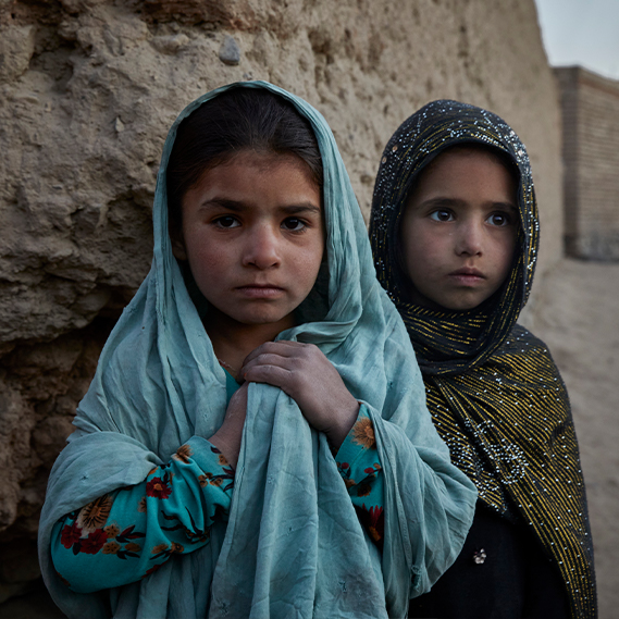 Two displaced girls © UNHCR/Andrew McConnell